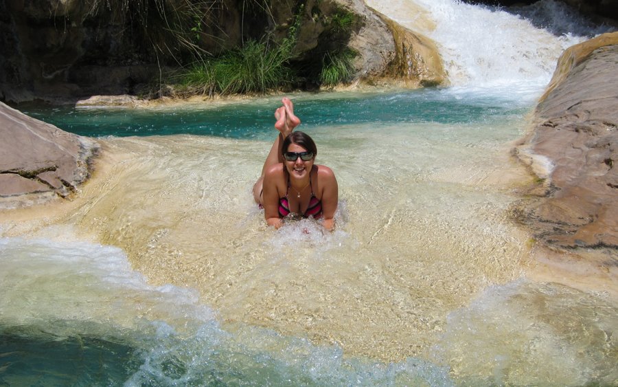 Woman in a river, clear water.