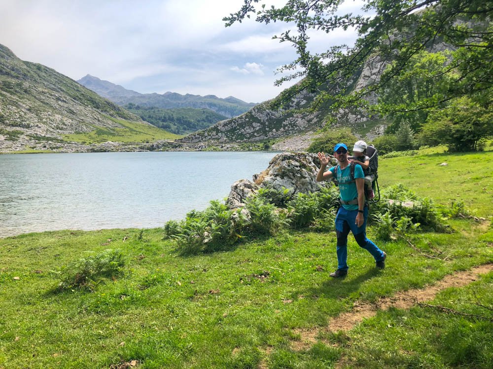 Family in the hiking trail near the lake